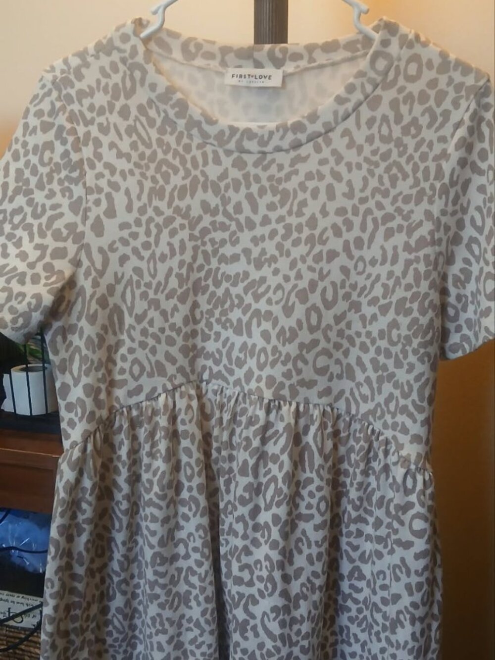 First Love brand short-sleeve leopard-print babydoll top with a ruffled waist